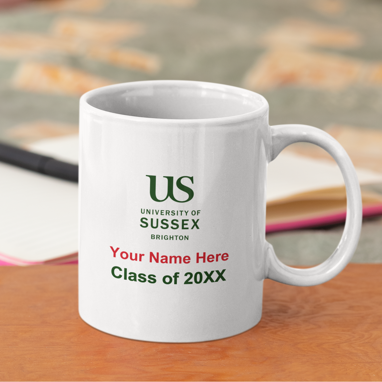 White mug with University of Sussex branding on