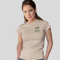 Woman wearing a beige t-shirt with 'US' logo on a light gray background