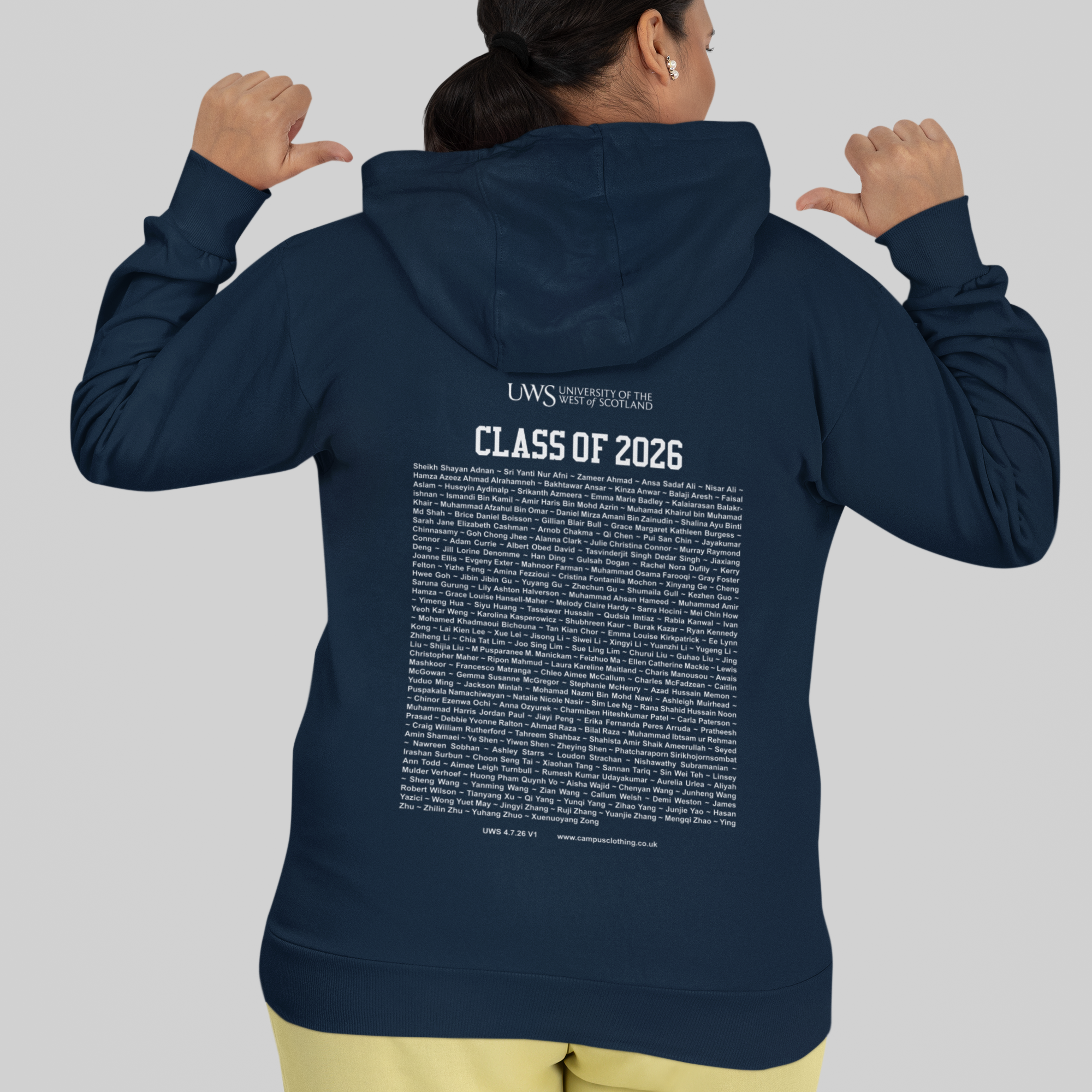 Person wearing a navy hoodie with 'Class of 2026' text on the back, standing against a plain background.