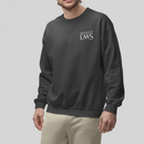 Man wearing a dark gray sweatshirt and beige pants on a light gray background