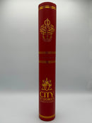 Red cylindrical product with gold accents and 'City of St. George's' branding on a white background